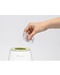 3103207000_2025_bebeconfort_bottlefeedacc_electricbottlewarmer_green_cuppouringwater